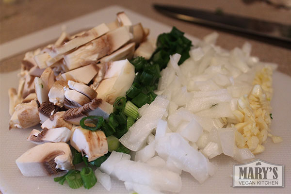 Chopped up mushrooms, scallions, onions, and garlic.