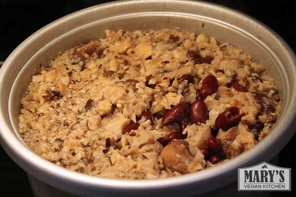 Rice cooker pot full of mushroom rice and beans