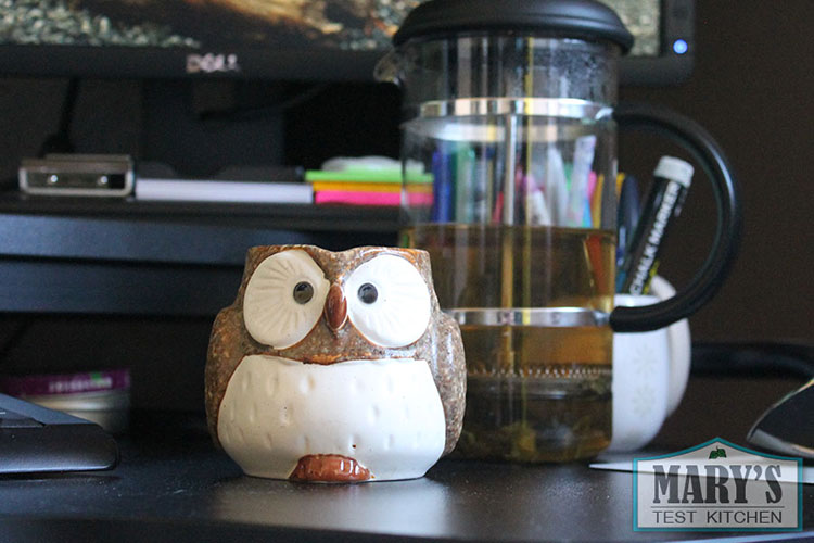 Green tea in an owl-shaped mug