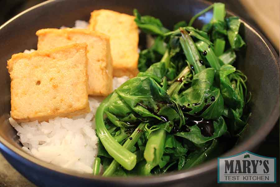 Rice bowl with snow pea greens and veggie tofu