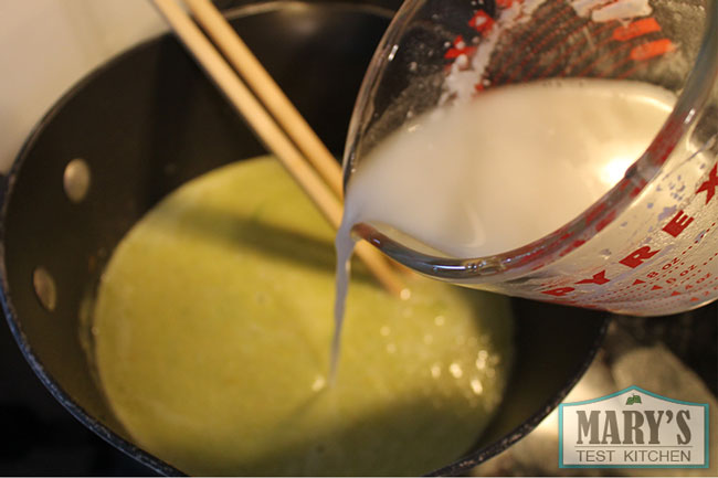 flour slurry poured into leek puree