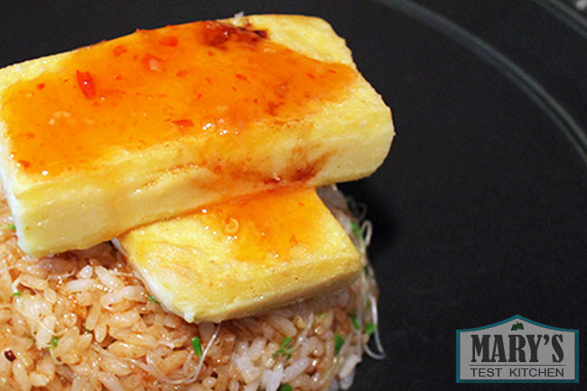 Burmese tofu with sweet chili sauce on rice