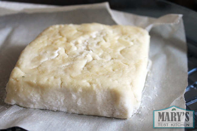 square block of cultured almond cheese