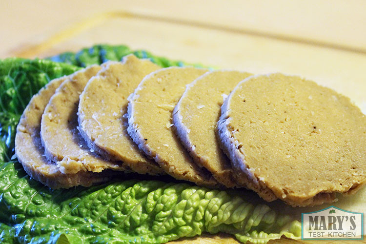 sliced seitan on lettuce