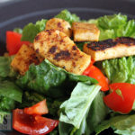 Charred five spice tofu on salad