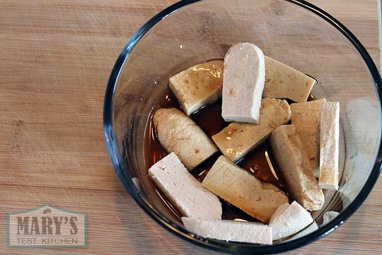 slices of tofu marinating