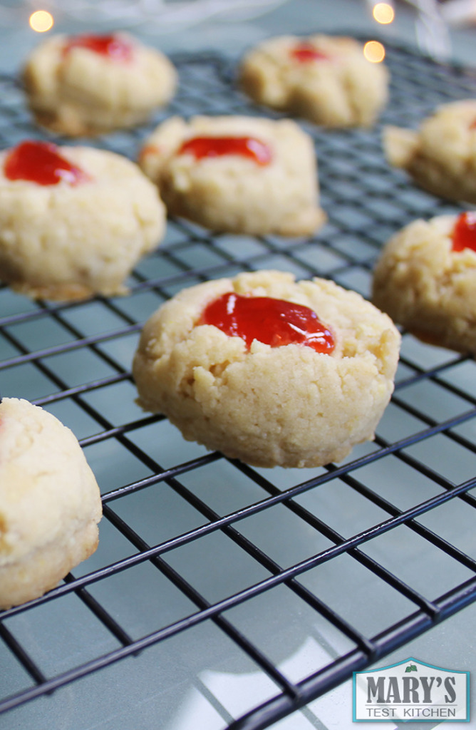 strawberry thumbprint cookies on cooling rack