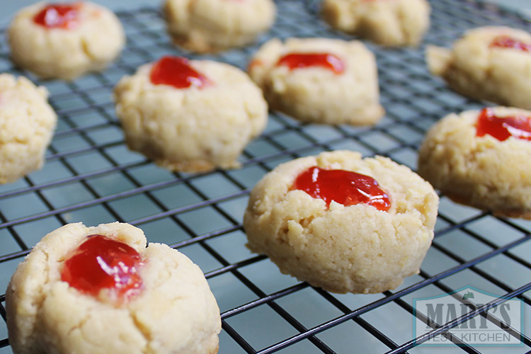 strawberry filled cookies on cooling rack