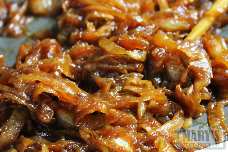 close up of deep brown caramelized onions