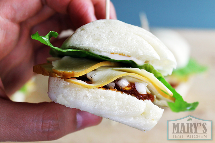 tofu, lettuce and onions sandwiched in a small steamed bun