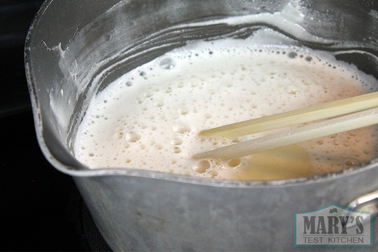 sweetened soymilk cooking on the stove