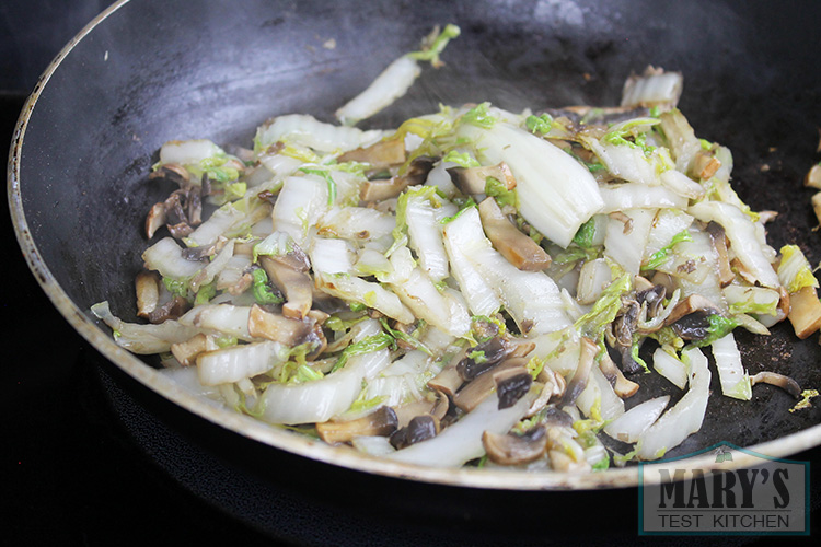 The portobello mushroom and napa cabbage get cooked to soften the cabbage and cook off some of the moisture.