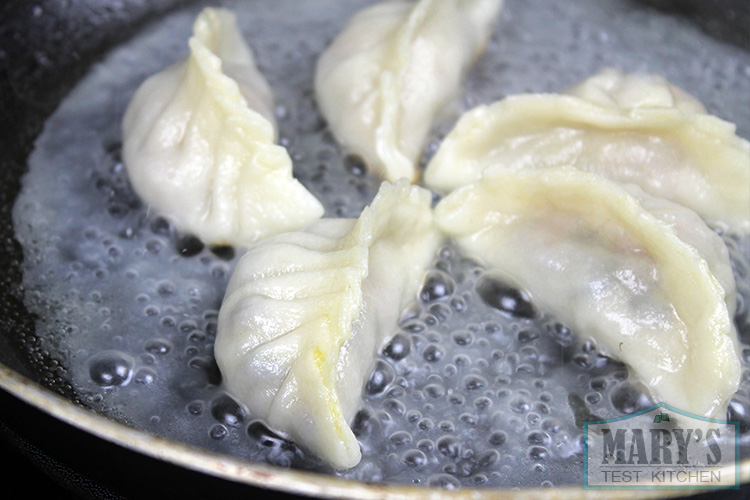 Making the mushroom dumplings potsticker-style!