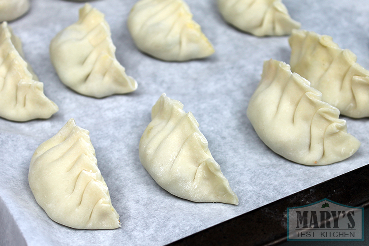 wrapped-dumplings-pleated-half-moon-uncooked