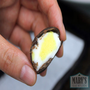 Inside of a vegan creme egg truffle