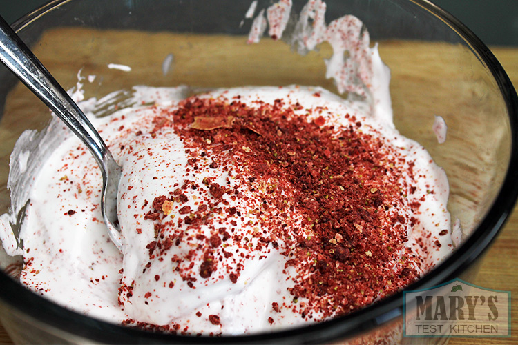 dried strawberry powder in a bowl of vegan meringue