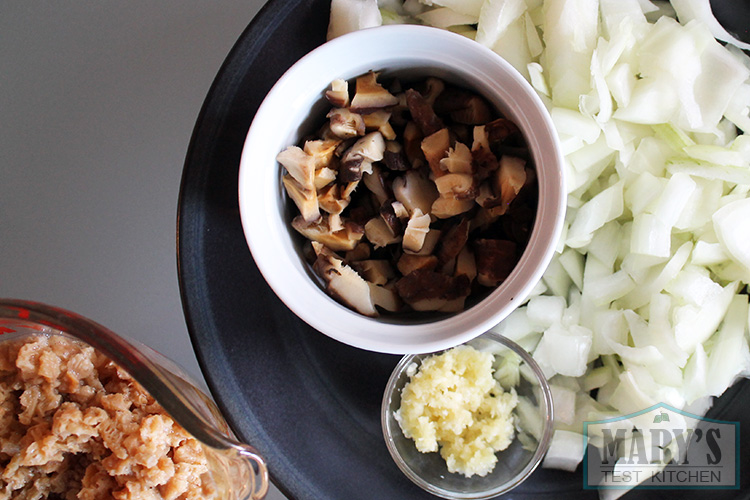 Chopped onions, shiitake mushrooms, and garlic in preparation for curry beefless crumbles!