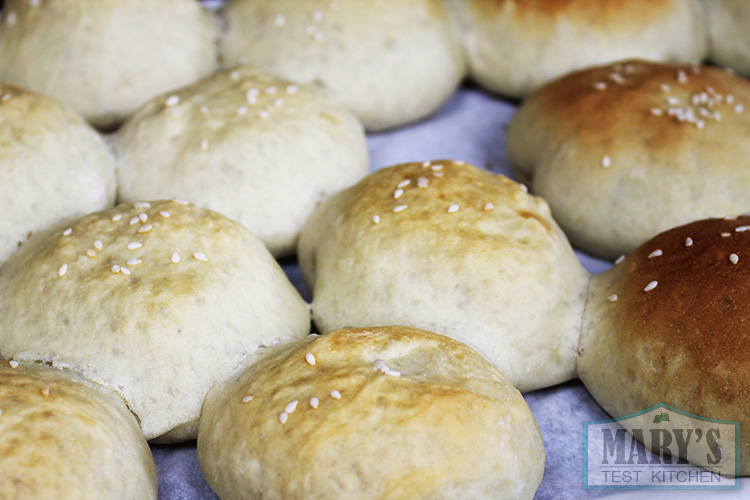 On the left: Vegan Curry Beefless Buns brushed with aquafaba. On the right, they are brushed with a simple maple syrup/water wash.