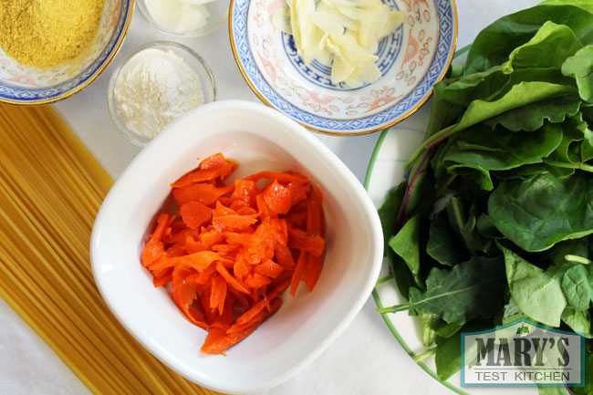 Vegan lox, spinach, sliced garlic and seasonings