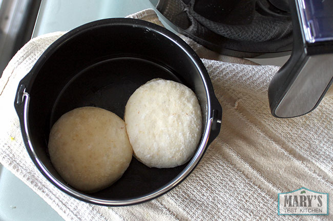 raw donuts in air fryer pan