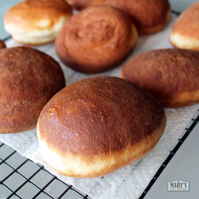 deep fried doughnuts on wire rack