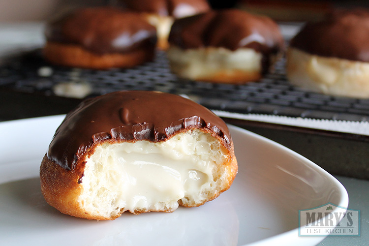 vegan boston cream donut bitten