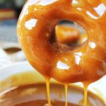 pumpkin spice donut dipped in caramel