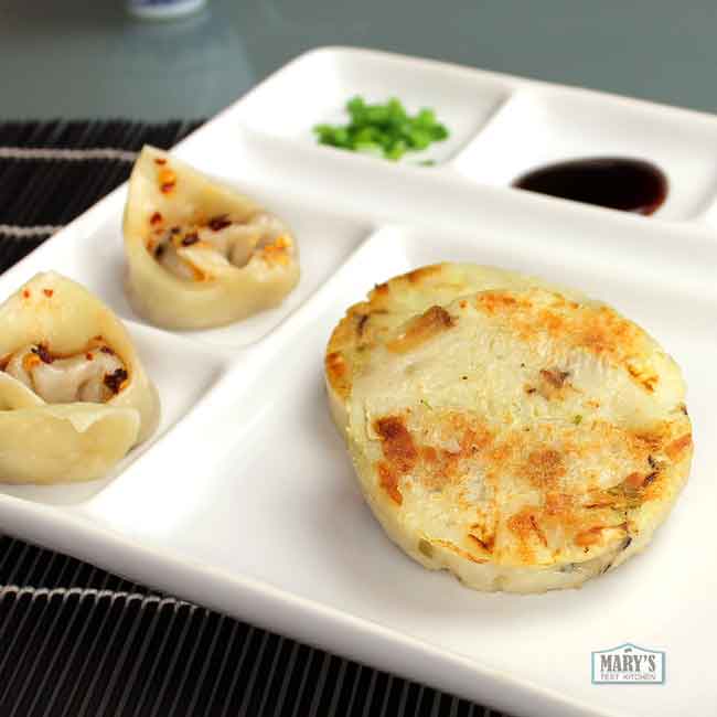 plate with Vegan Chinese Turnip Cake and mushroom dumplings