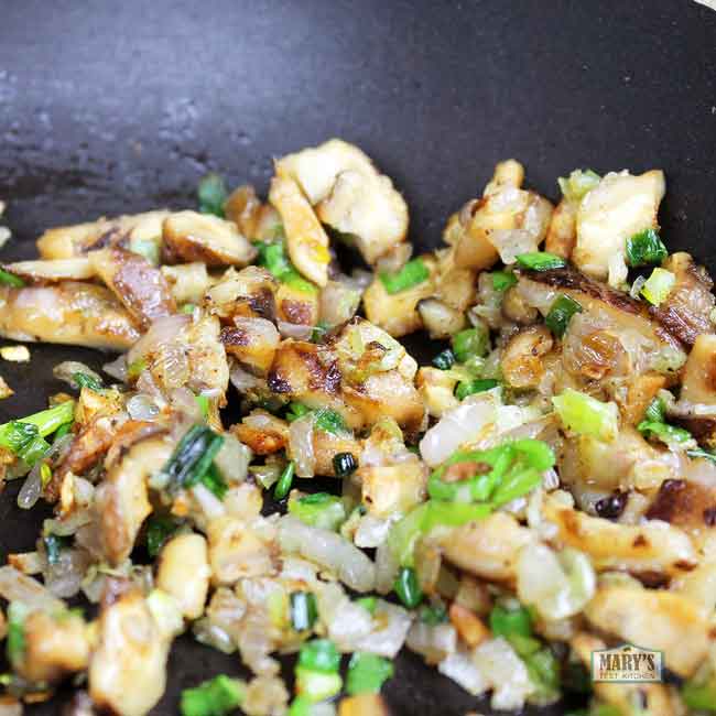 sauteing shiitake mushrooms, scallions, shallots and garlic