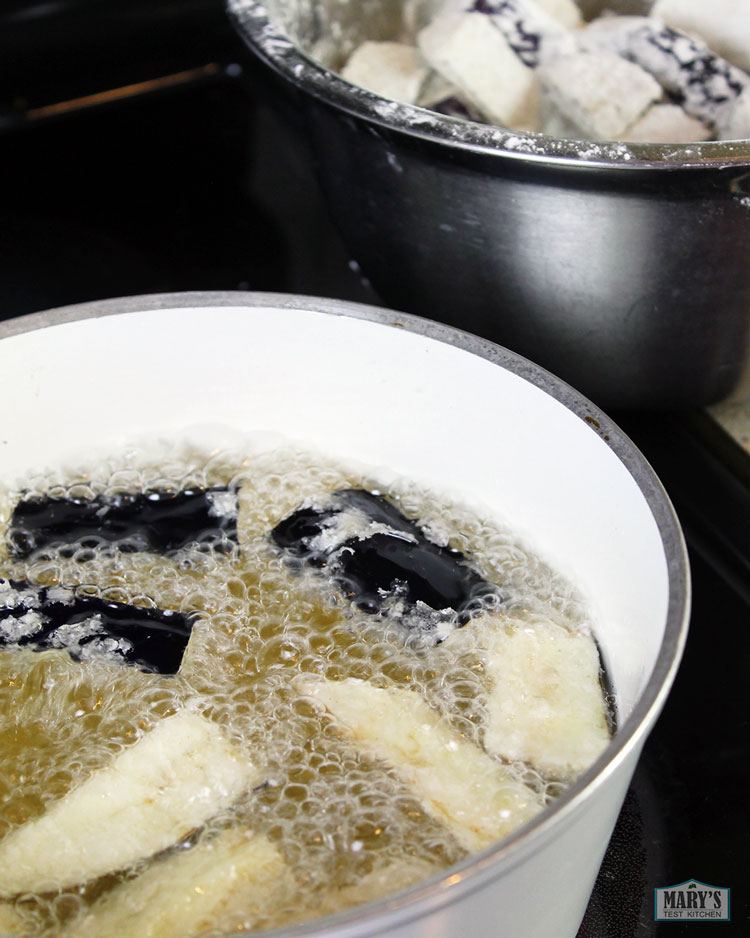 deep frying chinese eggplant on the stove