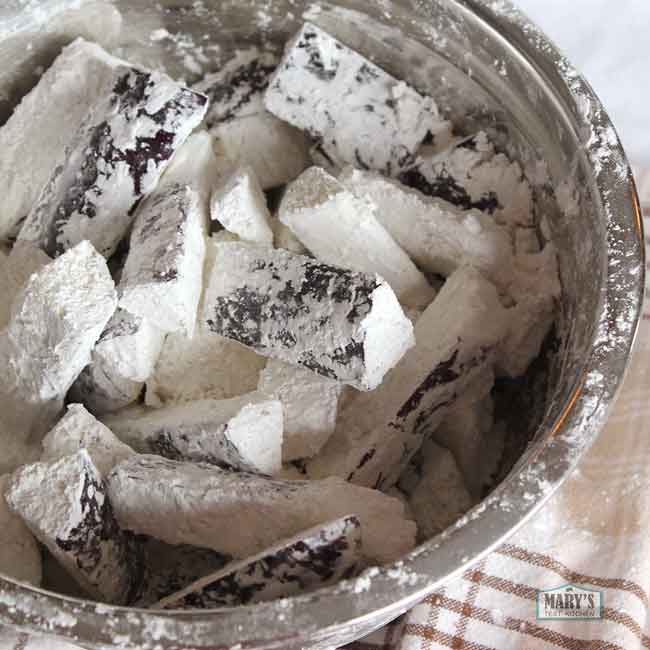 Chinese eggplant coated with cornstarch before frying