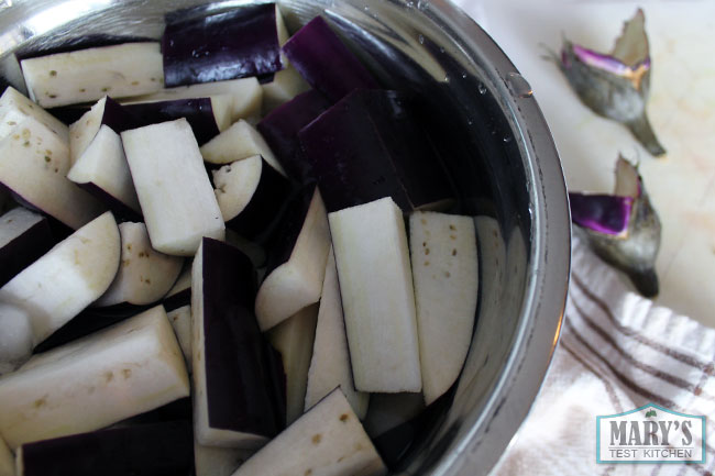 Chinese eggplant cut in preparation for frying