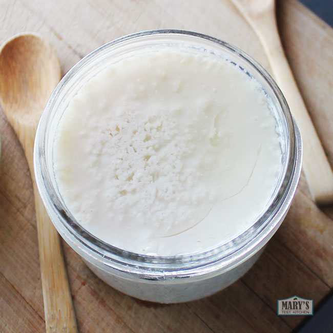 Short mason jar of steamed silken tofu