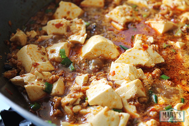 close up of mapo tofu in wok