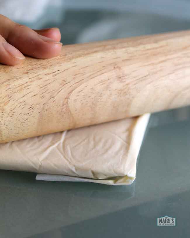 butter square in parchment for croissants