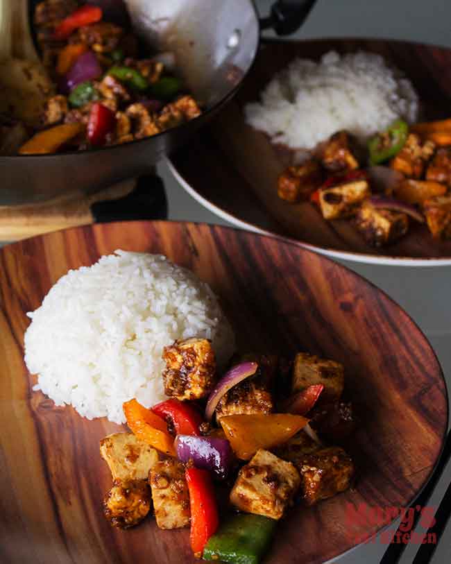 Two plates of Vegan Chinese Black Pepper Tofu with rice