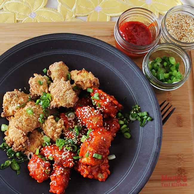 plate of Vegan Korean Fried Chicken, half with red sauce, half without