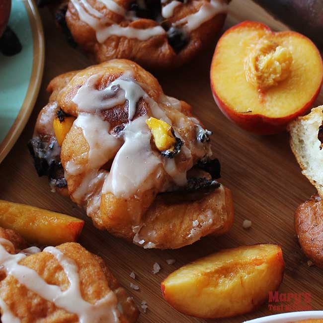 Display of vegan peach fritters with slices peaches