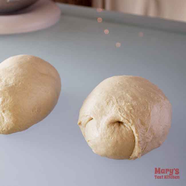 two rolled up pieces of shreddable seitan chicken dough