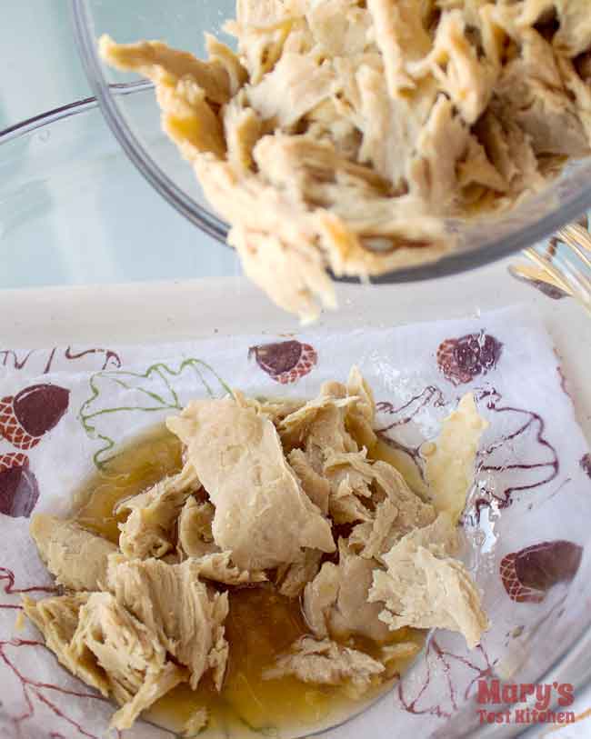 plain, shredded chickeny chickless seitan added to bowl of marinade