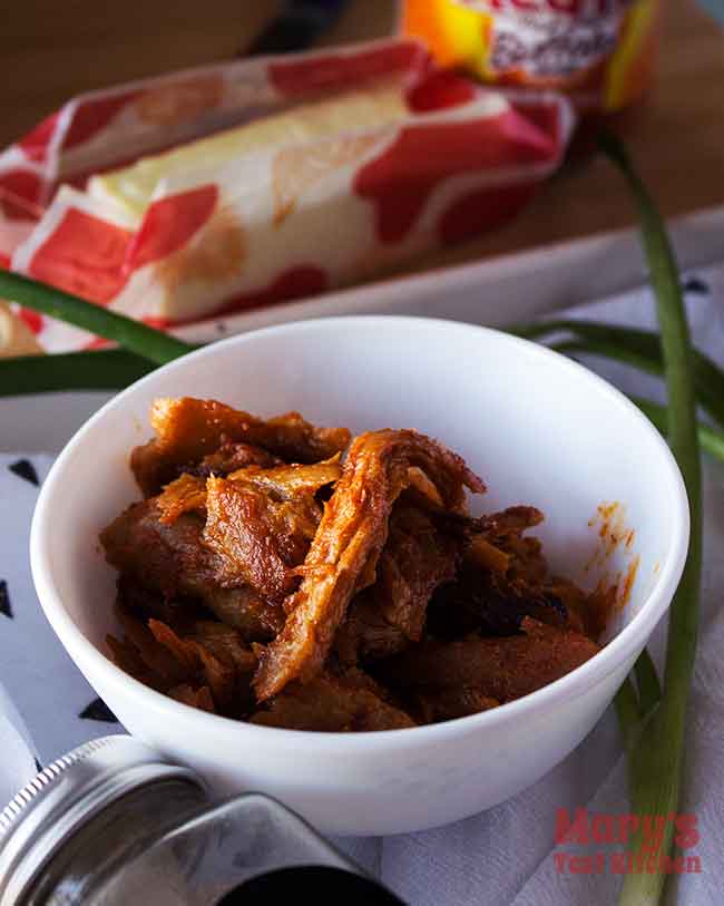 Bowl of Chickeny Chickless Seitan seasoned with Buffalo Sauce and spices