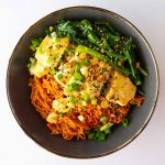 bird's eye view of vegan keto samyang buldak fire noodles copycat served with tofu and greens on top