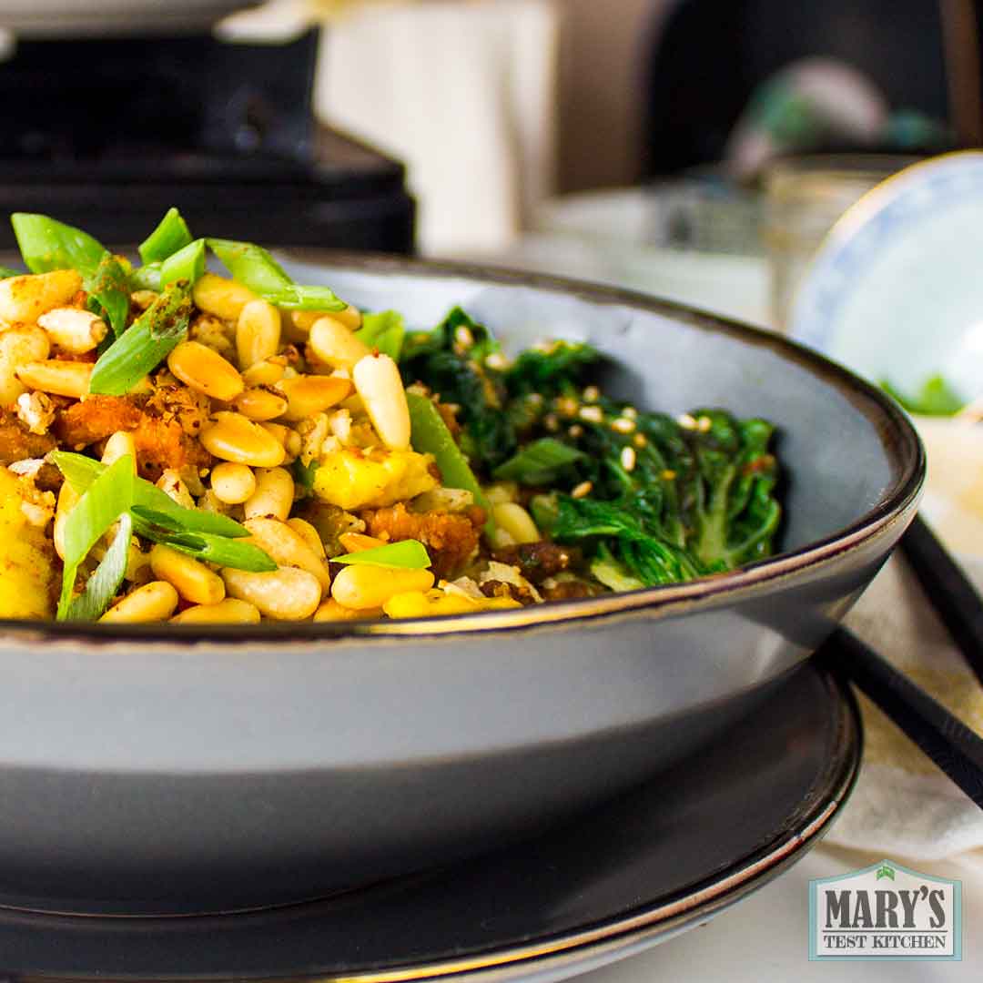 close up of Vegan Keto Fried Rice with pine nuts and chinese greens