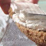 simple vegan cultured coconut butter being spread on bread