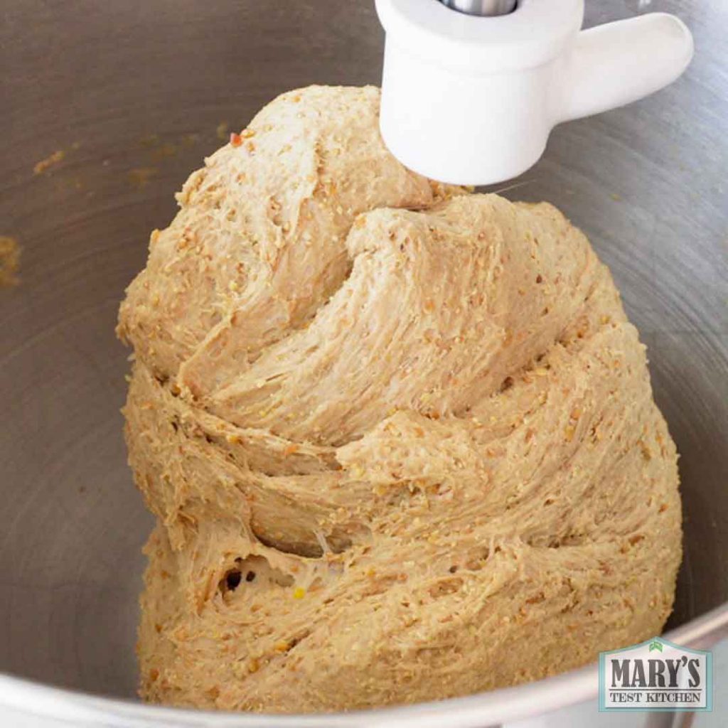 vegan keto sandwich bread being kneaded in a stand mixer