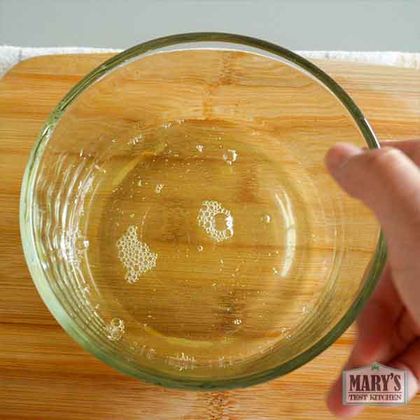 bowl of clear whey leftover from making pigeon pea tofu