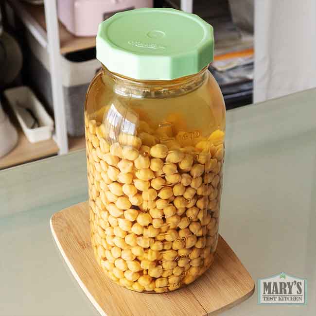 rehydrated chickpeas in water in jar