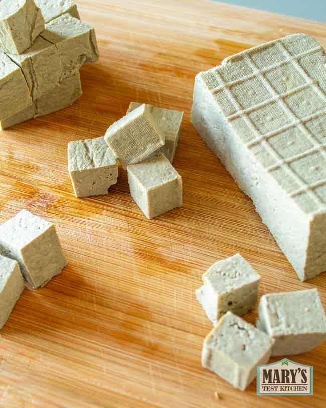 freshly cut cubes of black soybean tofu