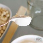 upside down spoon of Greek-style peanut yogurt