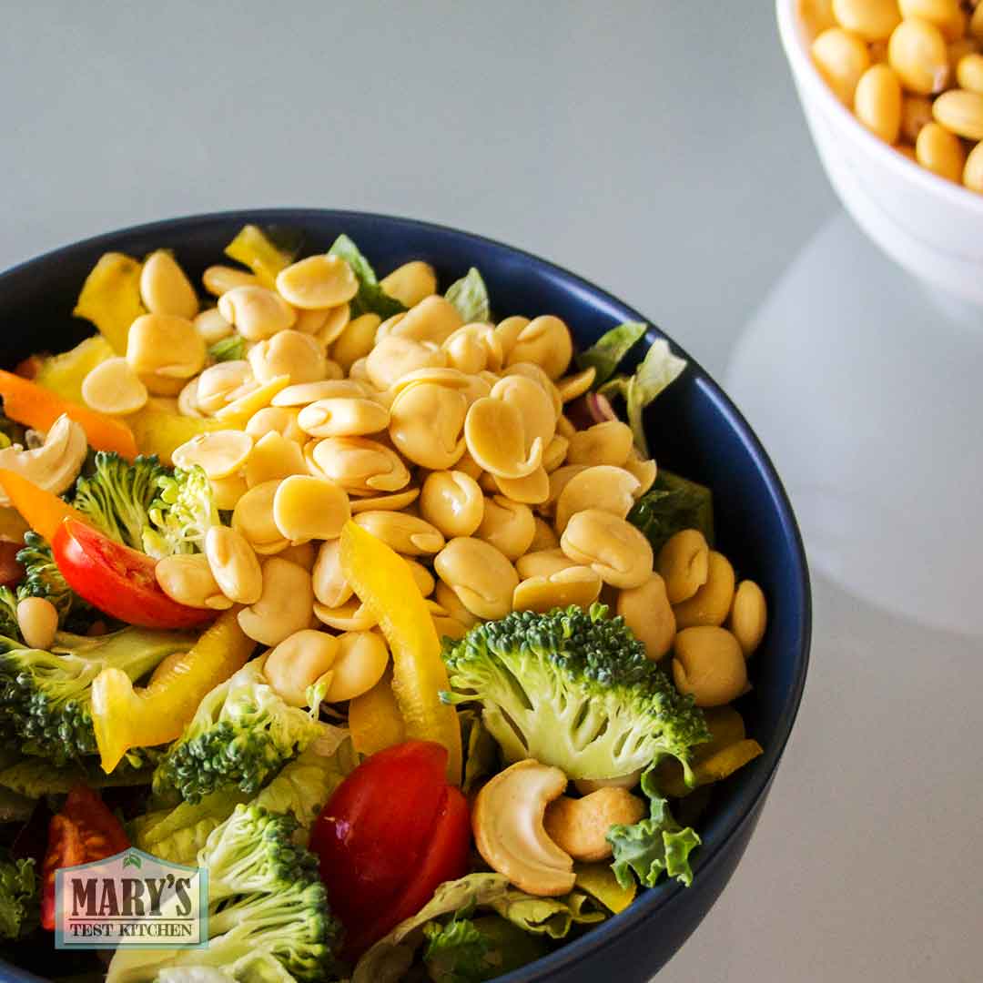 vegetable salad with hulled cooked sweet lupini beans on top